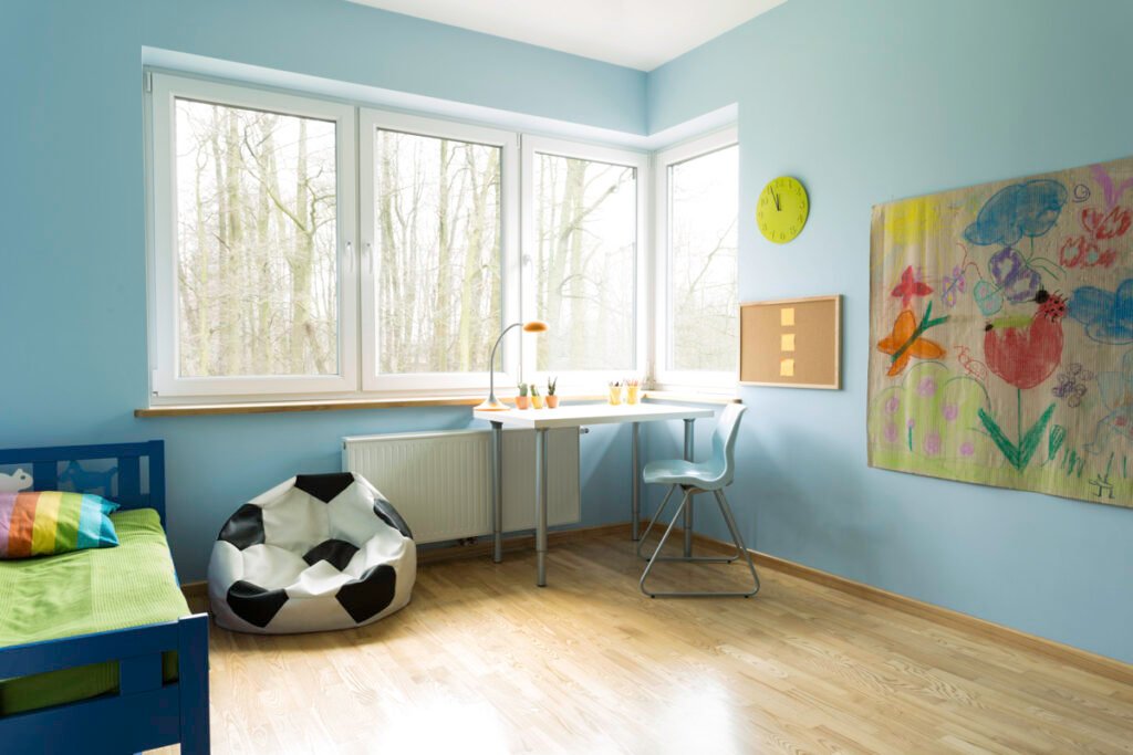 Fashionable new kid's room with wooden floor